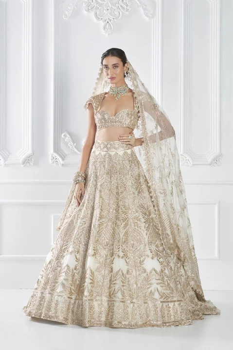 Manish Malhotra - Infuse your bridal trousseau with the artistry and  grandiose of the Awadhi regalia with our quintessential velvet bridal  lehenga with antique dori and zardosi hand embroidery, layered with a