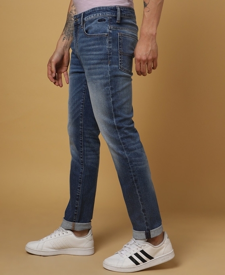 TOKYO SLIM WHISKERED RIPPED BLUE JEANS