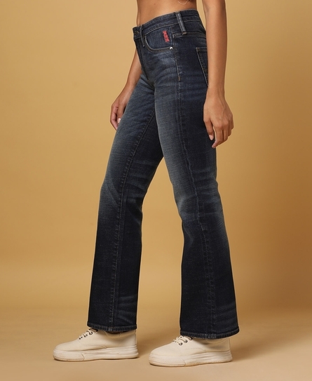 YURI BOOTCUT WHISKERED LIGHT DISTRESSED BLUE JEANS 
